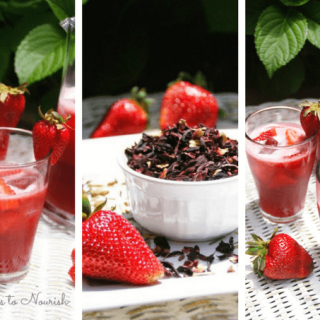 Hibiscus strawberry herbal iced tea in glasses and pitcher with dried hibiscus in a bowl and fresh strawberries.