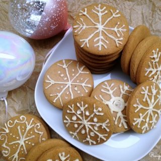 Gingerbread cookies frosted as snowflakes.