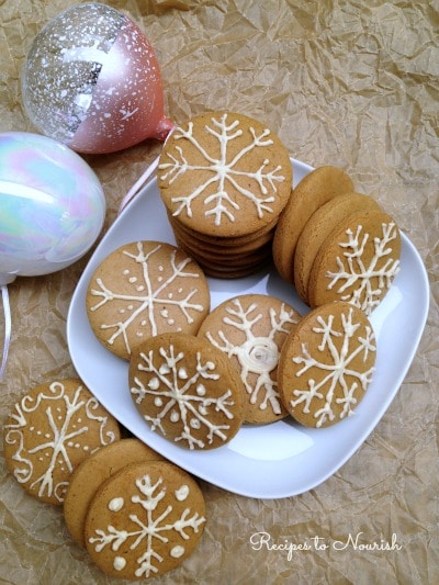 Gingerbread cookies frosted like snowflakes.