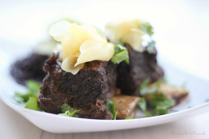 Instant Pot Asian Short Ribs seem so elegant, but they're super easy to make. Served with cucumber sunomono and cold noodles, these flavorful, tender, fall apart grass-fed short ribs are sure to please. | Recipes to Nourish