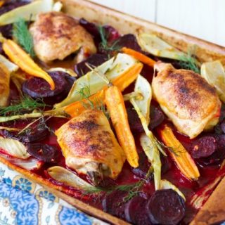 (Ad) This One Pan Roasted Chicken with Citrus Beets is an elegant, yet humble and cozy meal. The whole dinner bakes on one sheet pan in just one hour! Savory chicken is roasted to perfection with crispy skin and surrounded by delicious citrusy and herby sweet beets, carrots and fennel. | Recipes to Nourish