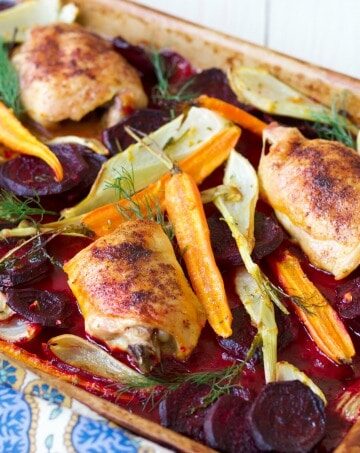 (Ad) This One Pan Roasted Chicken with Citrus Beets is an elegant, yet humble and cozy meal. The whole dinner bakes on one sheet pan in just one hour! Savory chicken is roasted to perfection with crispy skin and surrounded by delicious citrusy and herby sweet beets, carrots and fennel. | Recipes to Nourish