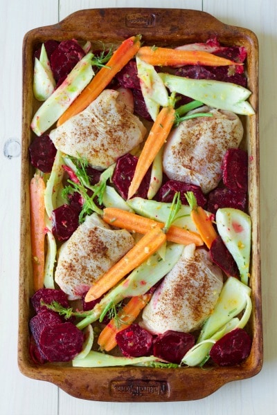 Chicken thighs, beets, carrots and fennel on a sheet pan.