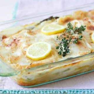 Creamy Vegetable Lasagna is pure comfort food. This real food version is packed with beautiful green vegetables, tangy lemon, fresh thyme and layered with a buttery cream sauce. It's gluten free with a grain free option too! | Recipes to Nourish