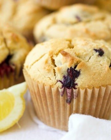 Grain free Blueberry Muffins are the perfect, protein-packed, on-the-go breakfast or afternoon snack. These delicious Paleo-friendly muffins are overflowing with blueberries and have a subtle buttery, lemon flavor. | Recipes to Nourish