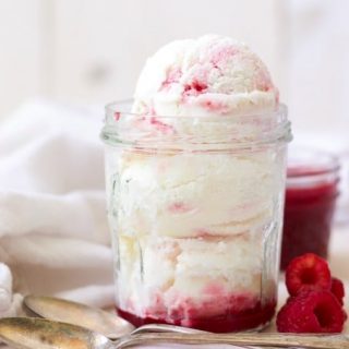 (ad) Creamy and smooth, plus sweet and tangy, this healthy Raspberry Swirl Frozen Yogurt is sure to please. With only 7 simple ingredients, this refreshing vanilla frozen yogurt with a beautiful, naturally sweetened, raspberry coulis is packed with protein and super easy to make. | Recipes to Nourish