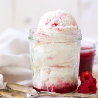 (ad) Creamy and smooth, plus sweet and tangy, this healthy Raspberry Swirl Frozen Yogurt is sure to please. With only 7 simple ingredients, this refreshing vanilla frozen yogurt with a beautiful, naturally sweetened, raspberry coulis is packed with protein and super easy to make. | Recipes to Nourish