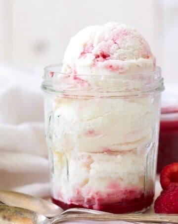 (ad) Creamy and smooth, plus sweet and tangy, this healthy Raspberry Swirl Frozen Yogurt is sure to please. With only 7 simple ingredients, this refreshing vanilla frozen yogurt with a beautiful, naturally sweetened, raspberry coulis is packed with protein and super easy to make. | Recipes to Nourish