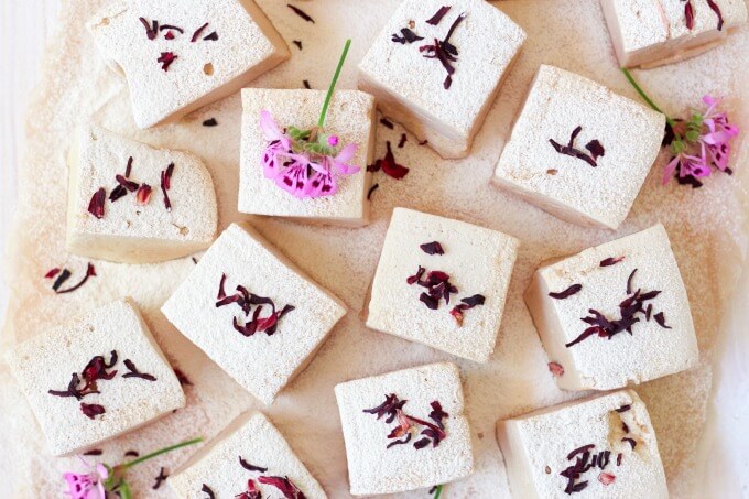 Square cut homemade marshmallows with dried hibiscus blossoms.