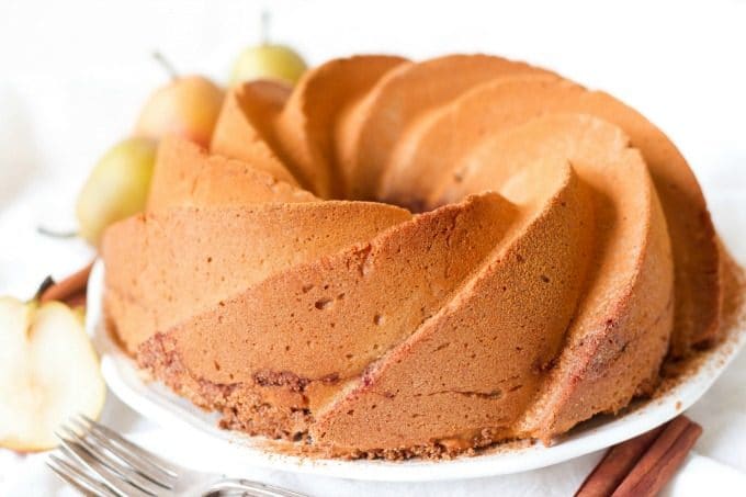 Grain Free Chai Spiced Pear Coffee Cake is the perfect treat for the cooler months and seasonal holidays. This heavenly coffee cake is soft with a moist crumb, deliciously spiced, packed with protein and brimming with a naturally sweetened crunchy topping. | Recipes to Nourish