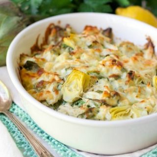 (ad) This Healthy Spinach Artichoke Chicken Casserole is total comfort food. It’s easy to make, packed with protein, brimming with spinach and artichoke hearts and full of flavor.