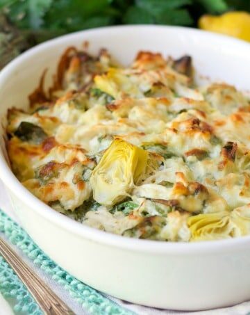 (ad) This Healthy Spinach Artichoke Chicken Casserole is total comfort food. It’s easy to make, packed with protein, brimming with spinach and artichoke hearts and full of flavor.
