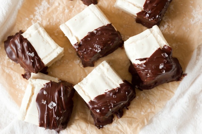 Homemade marshmallows dipped in chocolate and topped with flaked sea salt.