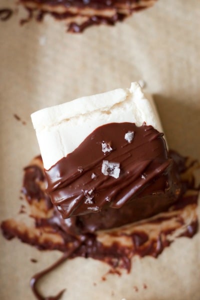 Homemade marshmallow dipped in chocolate topped with flaked sea salt.