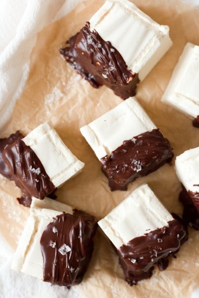 Homemade marshmallows dipped in chocolate and topped with flaked sea salt.