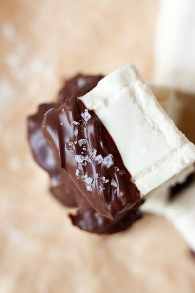 Homemade marshmallows dipped in chocolate and topped with flaked sea salt.