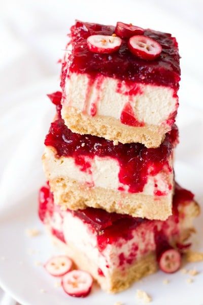 Slices of cranberry cheesecake bars.