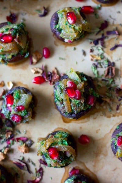 Stuffed mushrooms with herbs and pomegranate arils.