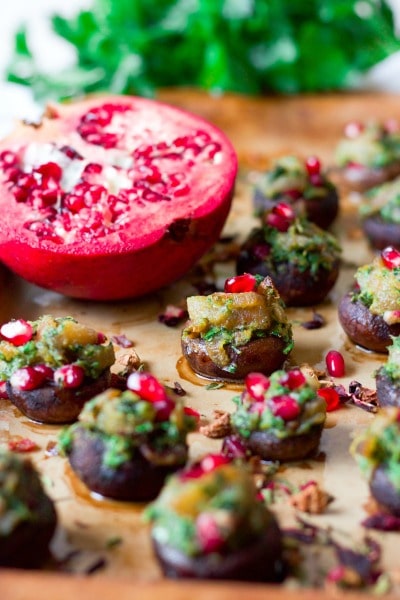 Stuffed mushrooms with herbs and pomegranate arils.