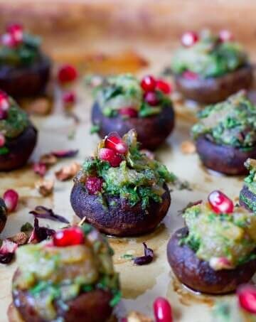 Stuffed mushrooms with herbs and pomegranate arils.