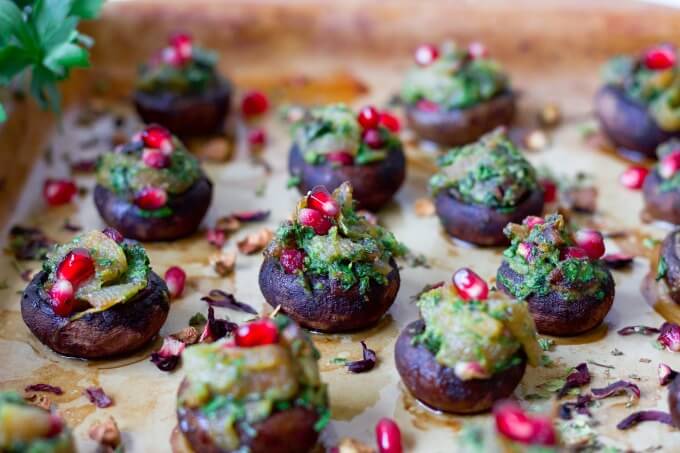 Stuffed mushrooms with herbs and pomegranate arils.