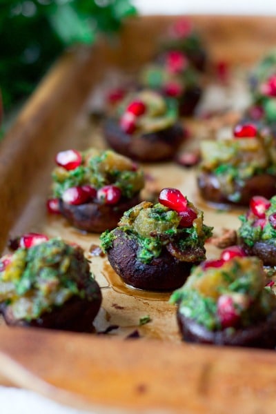 Stuffed mushrooms with herbs and pomegranate arils.