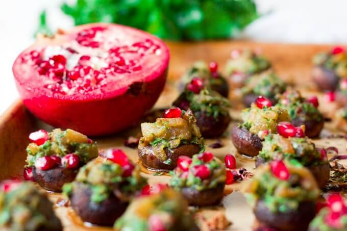 Stuffed mushrooms with herbs and pomegranate arils.