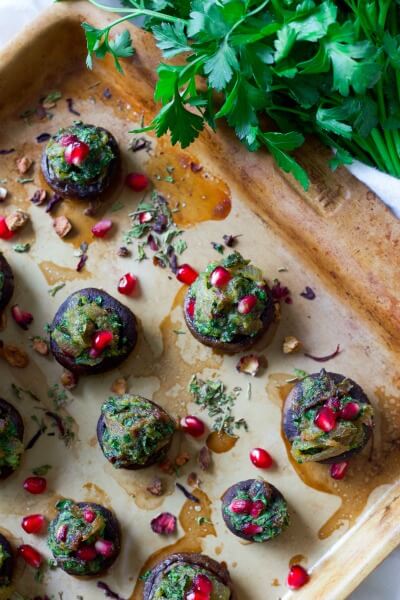 Stuffed mushrooms with herbs and pomegranate arils.