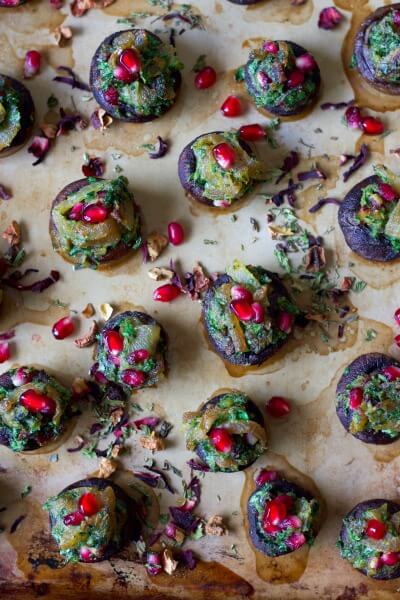 Stuffed mushrooms with herbs and pomegranate arils.