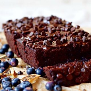 Chocolate banana bread with blueberries, chocolate chips and pieces of dried oranges.