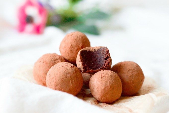 Cocoa dusted chocolate truffles and fresh flowers.