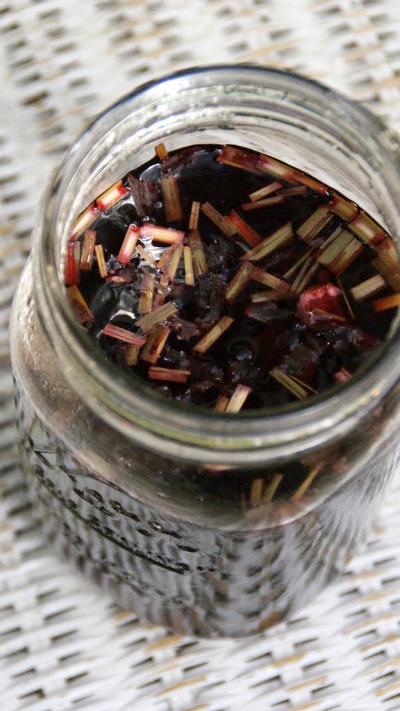 Hibiscus tea steeping in a mason jar.
