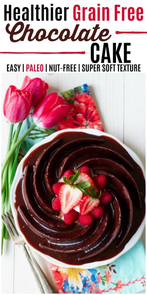 Chocolate cake in a spiral bundt shape, topped with chocolate glaze and fresh berries.