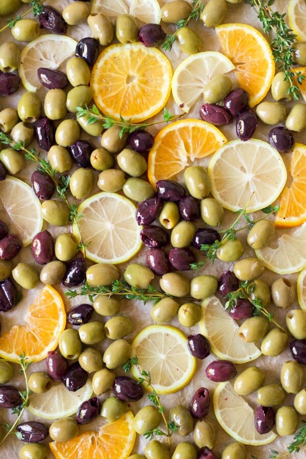 Olives, orange and lemon slices and fresh thyme.