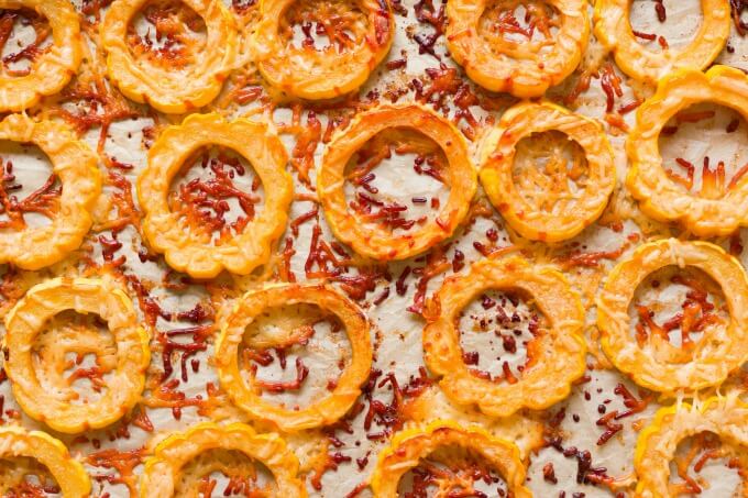 Roasted Delicata squash rounds with crispy parmesan.