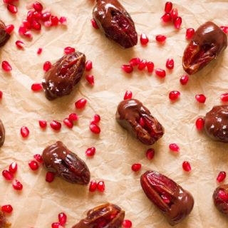 Chocolate dipped dates with pomegranate arils.
