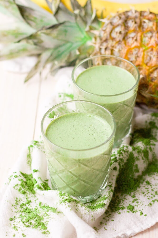 Green smoothies with matcha powder, pineapple and banana.