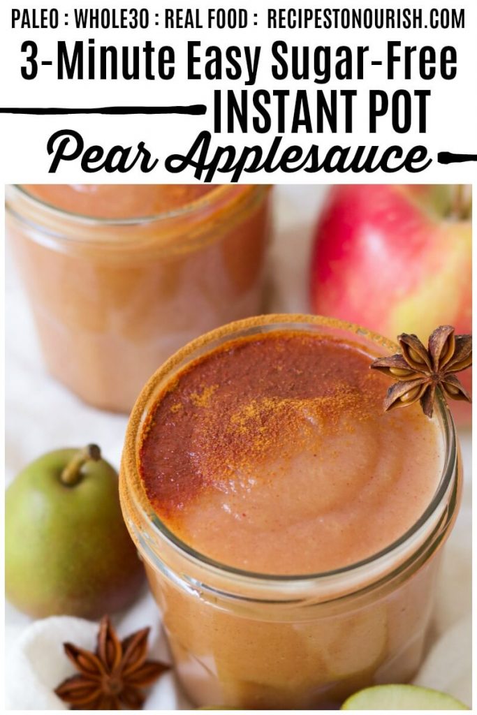 Jars of homemade pear applesauce topped with ground cinnamon next to fresh pears, apples and star anise pods.