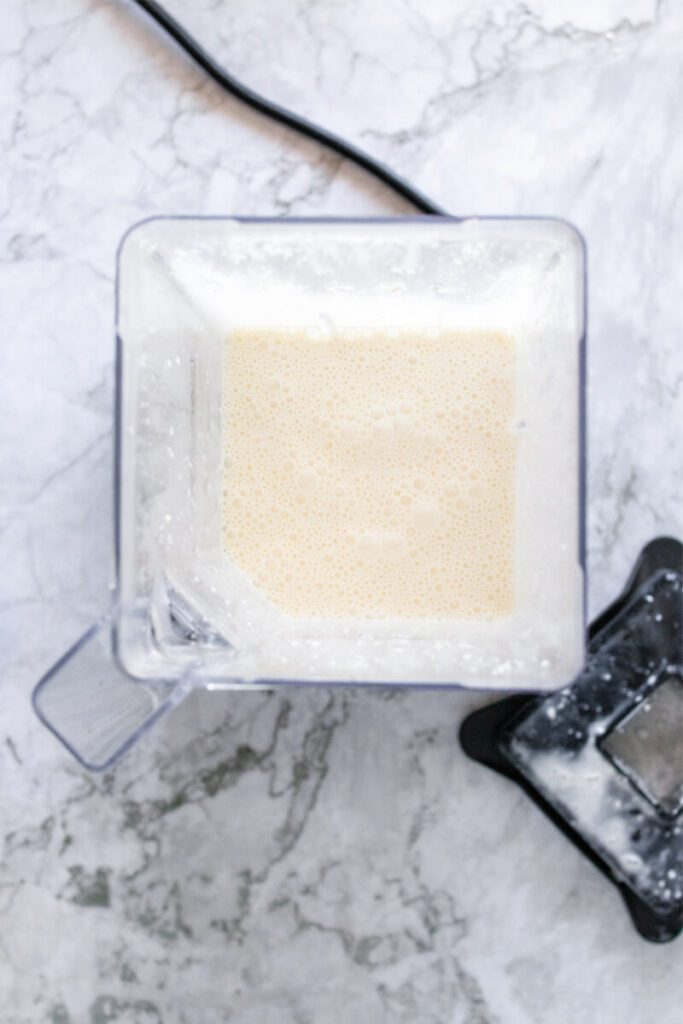Creamy mixture blended up in a blender.
